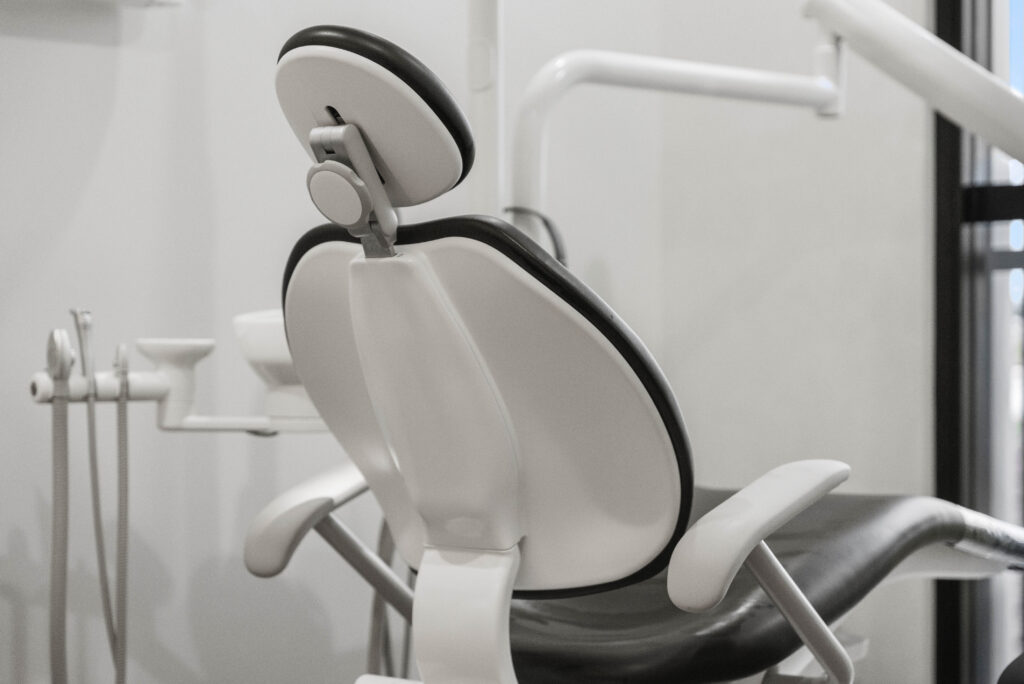 Accessible dental treatment room with space around the chair to support patient access and clinical care.