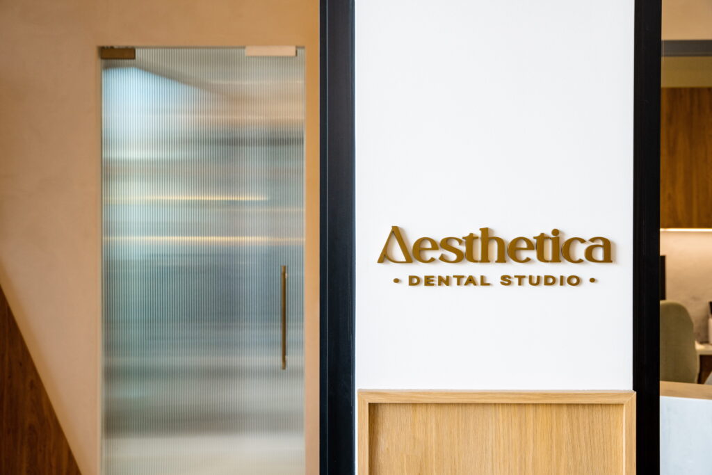 Integrated healthcare practice signage within a modern dental clinic fitout.